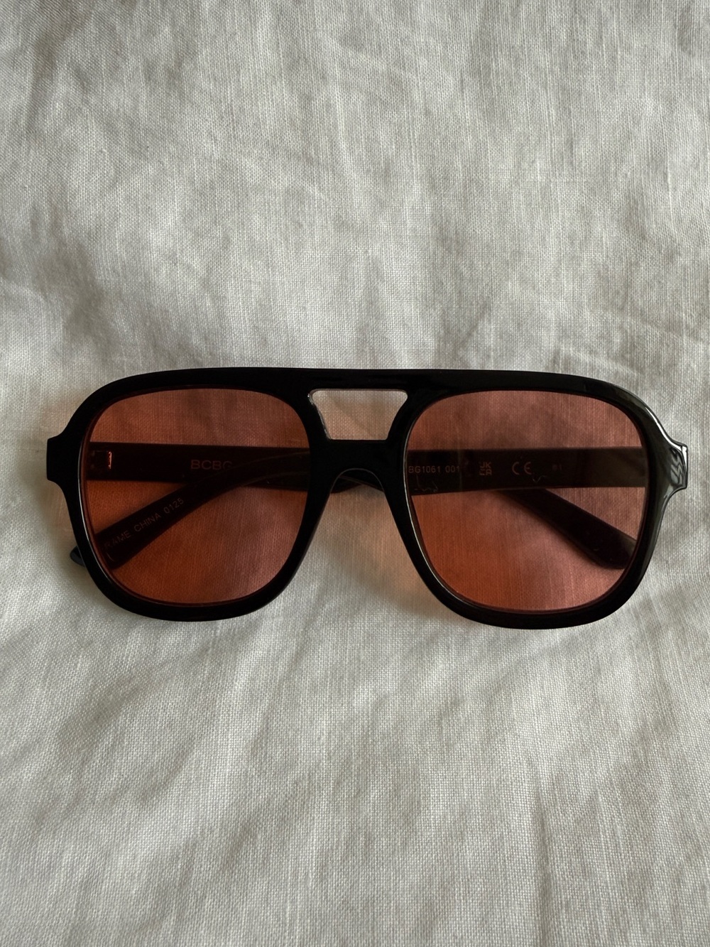 BCBG Black Frame Sunglasses with Orange/Brown Lenses